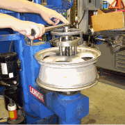 Alloy wheel straightening starts with the wheel being torqued in position on our custom wheel straightening machine